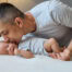 happy joyful father kissing his newborn baby home interior tenderly cradling his newborn cherishing early moments fatherhood enjoying peaceful bonding time bedroom